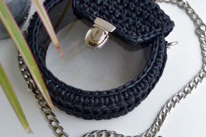 Круглая черная сумка с прозрачным окном - Описание