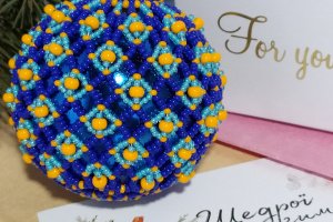 Новогодняя игрушка сине-оранжевый шар - Описание