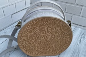 Кругла жіноча шкіряна сумочка через плече з ручкою - Опис