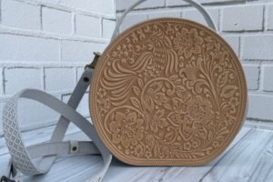 Кругла жіноча шкіряна сумочка через плече з ручкою - Опис