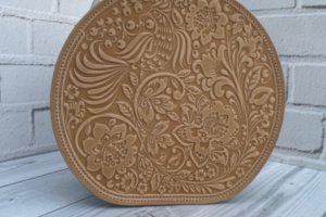 Кругла жіноча шкіряна сумочка через плече з ручкою - Опис