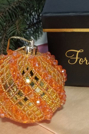 Робота Новорічна іграшка оранжево-золота куля